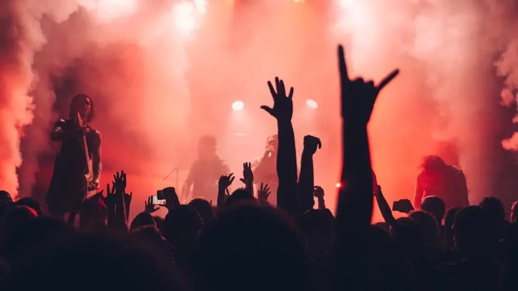 Festival-goers using phone charging stations at a music festival