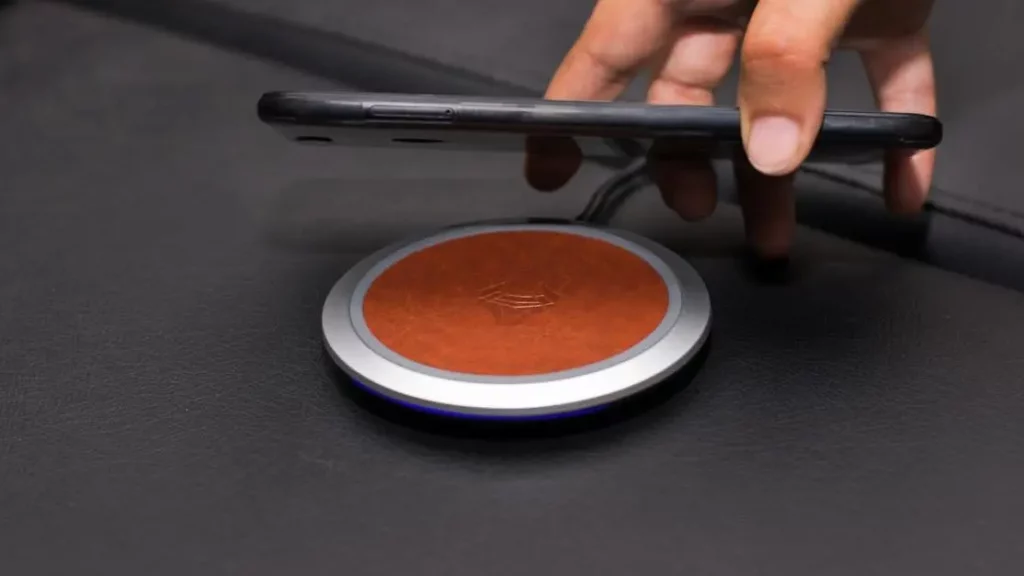 Close-up of smartphone on wireless charger, highlighting benefits of mobile charging solutions.