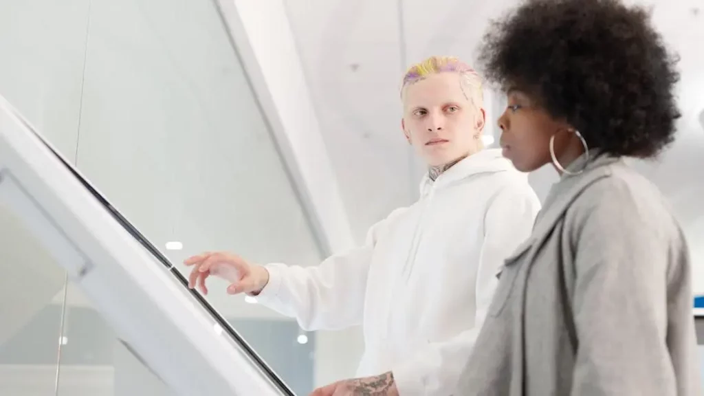 Adults using a Phone Charging Kiosk in a modern business environment.