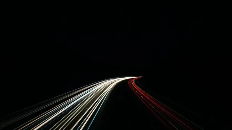 Light trails on highway at night, illustrating scalable solutions for high-traffic locations.