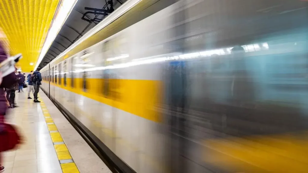 Train speeds through a busy subway, illustrating charging stations for high-traffic areas.